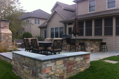 Naperville bluestone patio, outdoor kitchen, and fireplace