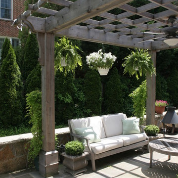Natural Wood Pergola with Hanging Plants over Flagstone Patio