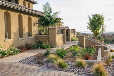 Large elegant backyard concrete paver patio photo in San Diego