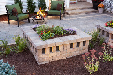 Inspiration for a transitional front yard concrete paver patio remodel in Minneapolis