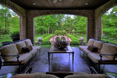 Inspiration for a mid-sized timeless backyard patio remodel in Columbus with a gazebo