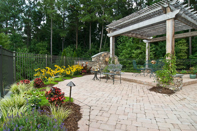 Example of a large transitional patio design in Charlotte