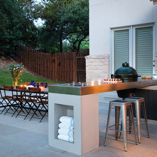 Esempio di un patio o portico minimal di medie dimensioni e dietro casa con pavimentazioni in cemento e nessuna copertura