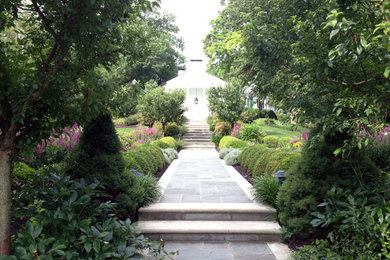 Inspiration for a large traditional backyard stone landscaping in Cincinnati.