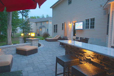 Example of a transitional patio design in New York