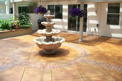 Inspiration for a courtyard patio in Atlanta with concrete slabs and a pergola.