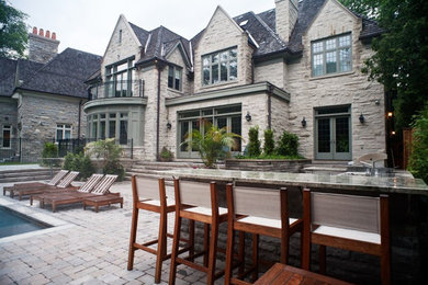 Example of a transitional patio design in Toronto