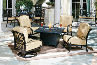 Inspiration for a large mediterranean courtyard tile patio remodel in Atlanta with a fire pit and no cover