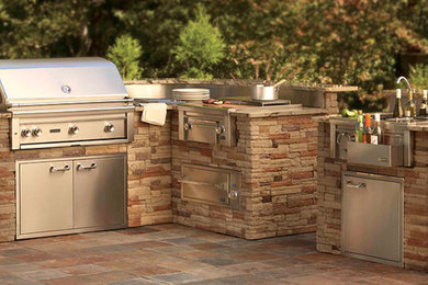 Mid-sized arts and crafts backyard tile patio kitchen photo in Atlanta with no cover