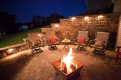 Small transitional backyard concrete paver patio photo in Other with a fire pit and no cover