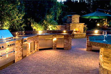 Patio kitchen - large traditional backyard brick patio kitchen idea in San Diego with no cover