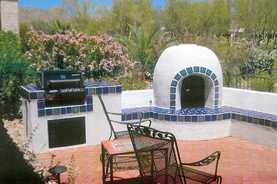 Patio - mid-sized traditional backyard brick patio idea in Phoenix with a fire pit and no cover