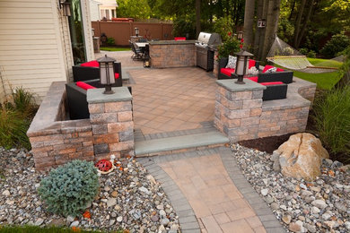 Mid-sized elegant backyard concrete paver patio kitchen photo in Philadelphia with no cover