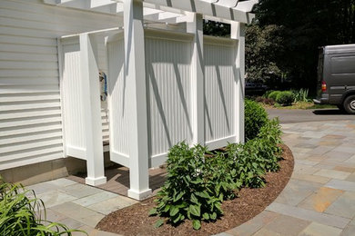 Outdoor patio shower - small traditional backyard outdoor patio shower idea in Bridgeport with decking and a pergola