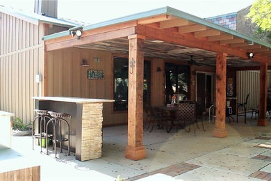 Mid-sized arts and crafts backyard concrete patio kitchen photo in San Diego with a pergola