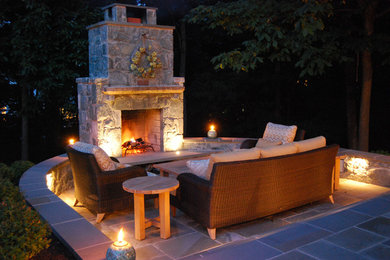 Patio - mid-sized traditional backyard stone patio idea in DC Metro with a fire pit and no cover
