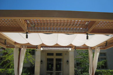 Inspiration for a large transitional backyard patio remodel in San Francisco with a pergola