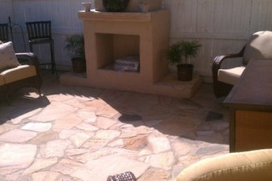 Patio - mid-sized traditional backyard stone patio idea in Birmingham with a fire pit and no cover