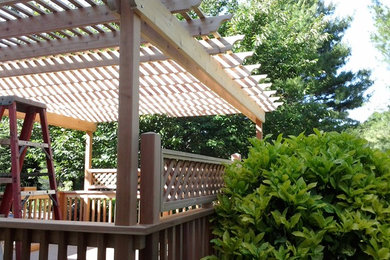 Design ideas for a medium sized classic back patio in Philadelphia with a pergola.