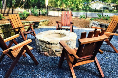 Inspiration for a mid-sized timeless backyard gravel patio remodel in Atlanta with a fire pit and no cover