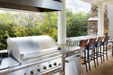 Mid-sized island style backyard tile patio kitchen photo in Charleston with a roof extension