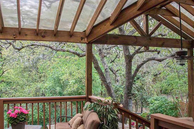 Inspiration for a mid-sized timeless backyard patio remodel in Austin with decking and a gazebo
