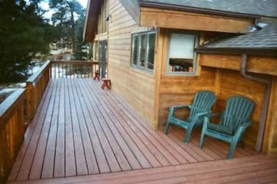 Mid-sized backyard patio photo in Denver with decking