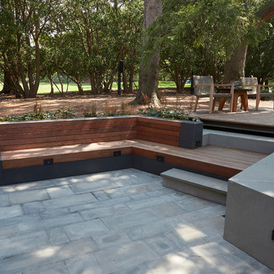 Example of a mid-sized trendy backyard patio design in New York with decking and no cover
