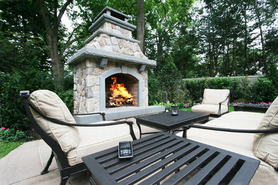 Patio - mid-sized traditional backyard patio idea in New York with a fire pit and no cover