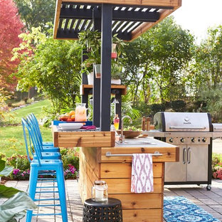 Example of a trendy backyard patio kitchen design in Other