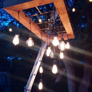 Immagine di un piccolo patio o portico eclettico dietro casa con ghiaia e nessuna copertura