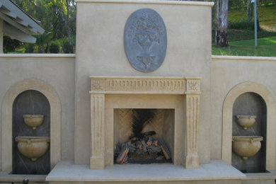 Example of a mid-sized backyard concrete patio design in San Diego with a fire pit and no cover