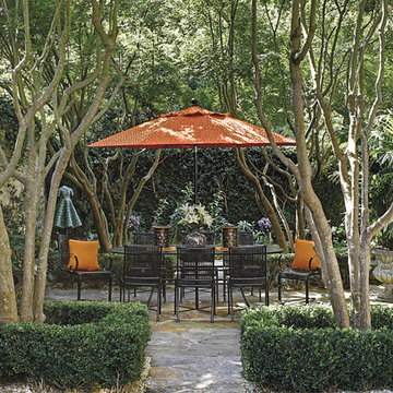 outdoor dining set with patio umbrella and spring chairs in wrought iron