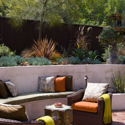 Example of a tuscan tile patio design in Los Angeles with no cover