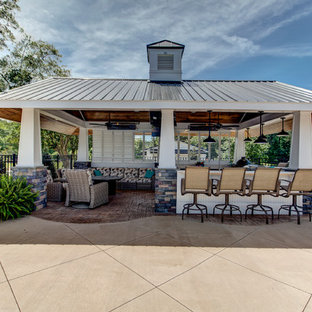 Inspiration for a large nautical back patio in Raleigh with an outdoor kitchen, stamped concrete and a gazebo.