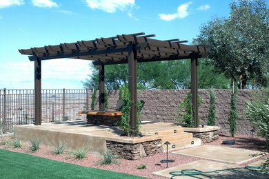 Patio - rustic backyard gravel patio idea in Las Vegas with a fire pit and a pergola