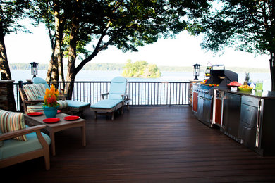 Example of a beach style backyard patio kitchen design in Other with decking