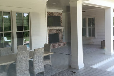 Design ideas for a medium sized classic back patio in Atlanta with concrete paving and a roof extension.