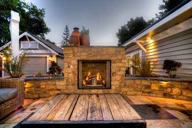 Example of an arts and crafts patio design in San Francisco with a fireplace