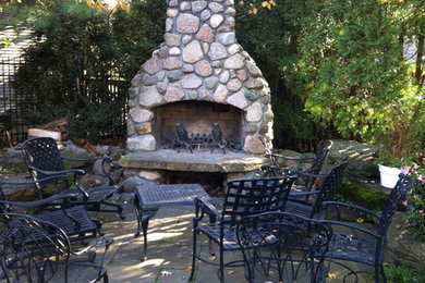 Patio - traditional backyard concrete paver patio idea in Chicago with a fire pit and no cover