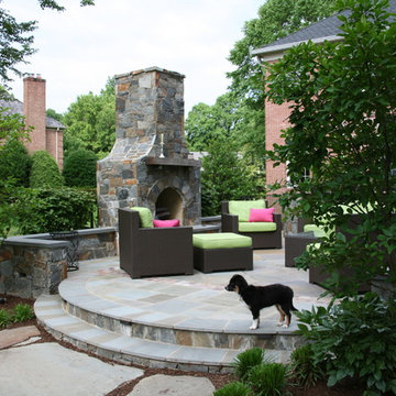 Outdoor Fireplace on Flagstone Patio with Wicker Furniture