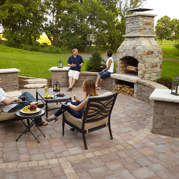 Outdoor Fireplace: Paver patio with seat wall and fireplace