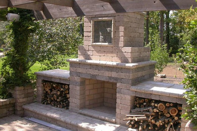 Inspiration for a mid-sized craftsman backyard brick patio remodel in Columbus with a fire pit and a pergola