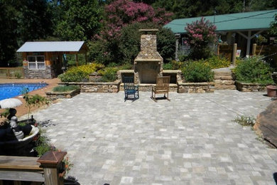 This is an example of a patio in Birmingham with a fire feature.