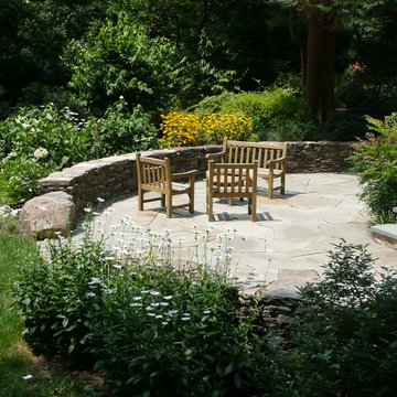 Outdoor flagstone patio with dry stack seat wall