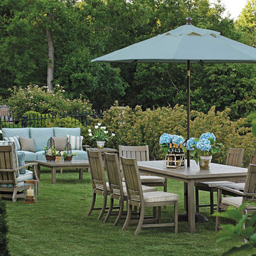 Outdoor furniture set with patio umbrella in wrought aluminum