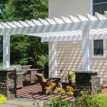 Outdoor grill and overhanging pergola