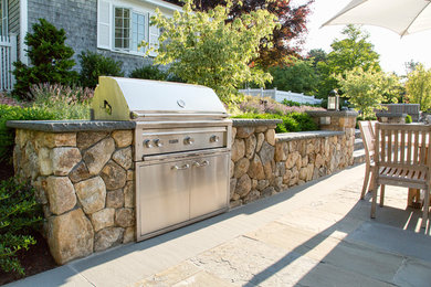 Patio kitchen - large traditional backyard patio kitchen idea in Boston with no cover