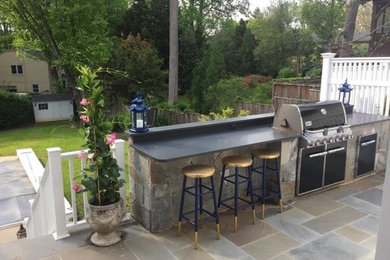 Inspiration for a mid-sized timeless backyard concrete paver patio kitchen remodel in DC Metro with no cover