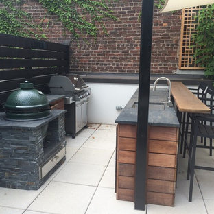 Inspiration for a mid-sized contemporary courtyard tile patio kitchen remodel in New York with no cover